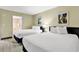 Inviting bedroom featuring two beds with plush linens and direct access to an attached bathroom at 2301 S Ocean Blvd. # 1405, North Myrtle Beach, SC 29582