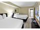 Bedroom with two beds and in-unit laundry at 2301 S Ocean Blvd. # 1405, North Myrtle Beach, SC 29582
