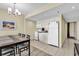 Well-equipped kitchen features white appliances and ample counter space near the dining area at 2301 S Ocean Blvd. # 1405, North Myrtle Beach, SC 29582