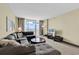 Comfortable living area featuring a large sofa, beach-themed décor, and ocean views from the sliding doors at 2301 S Ocean Blvd. # 1405, North Myrtle Beach, SC 29582