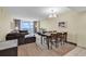 Bright living room features a dining table and a balcony with an ocean view at 2301 S Ocean Blvd. # 1405, North Myrtle Beach, SC 29582