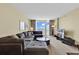 Cozy living room featuring comfortable seating, large windows with scenic views, and a modern entertainment center at 2301 S Ocean Blvd. # 1405, North Myrtle Beach, SC 29582