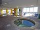 Inviting indoor pool area with multiple hot tubs and plenty of natural light, beach views at 2301 S Ocean Blvd. # 1405, North Myrtle Beach, SC 29582