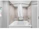 Relaxing bathroom with a white jacuzzi tub, showerhead, and soft lighting, providing a spa-like experience at 2301 S Ocean Blvd. # 702, North Myrtle Beach, SC 29582