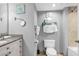 Well-appointed bathroom featuring granite countertops, vanity storage, and tasteful beach-themed decor, creating a coastal vibe at 2301 S Ocean Blvd. # 702, North Myrtle Beach, SC 29582