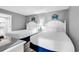 Relaxing bedroom with two beds, modern decor, and a partial view of the attached bath at 2301 S Ocean Blvd. # 702, North Myrtle Beach, SC 29582