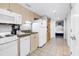 Well-lit kitchen featuring white appliances, light cabinets, and granite countertops, perfect for cooking and meal preparation at 2301 S Ocean Blvd. # 702, North Myrtle Beach, SC 29582