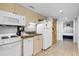 Efficient kitchen with modern appliances, granite counters, and direct access to a bedroom, ideal for compact living at 2301 S Ocean Blvd. # 702, North Myrtle Beach, SC 29582
