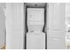 Laundry closet containing a stacked washer and dryer combo at 2301 S Ocean Blvd. # 702, North Myrtle Beach, SC 29582