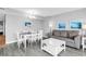 Open concept living and dining area featuring modern furnishings, ample seating, and lots of natural light at 2301 S Ocean Blvd. # 702, North Myrtle Beach, SC 29582