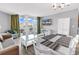 Open condo living space featuring modern decor, dining set, balcony access, and lots of natural light at 2301 S Ocean Blvd. # 702, North Myrtle Beach, SC 29582