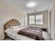 Comfortable bedroom features a plush bed, a window with natural light, and neutral colors at 2309 Withers Dr., Myrtle Beach, SC 29577