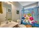Kid-friendly bathroom features a playful Baby Shark shower curtain and bright decor at 2461 Summerhaven Loop, Conway, SC 29527