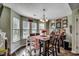 Bright dining room featuring natural light, wood table, and stylish decor at 2461 Summerhaven Loop, Conway, SC 29527
