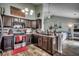 Open kitchen boasts stainless steel appliances, dark cabinetry, and seamless flow to the living area at 2461 Summerhaven Loop, Conway, SC 29527