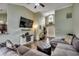 Well-lit living room with fireplace, sectional seating, and an open layout to the entryway at 2461 Summerhaven Loop, Conway, SC 29527