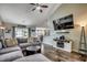 Inviting living room featuring plush sectional, fireplace, and a view into the dining area at 2461 Summerhaven Loop, Conway, SC 29527