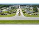 Stunning aerial view of a community entrance, featuring lush greenery, ponds, and well-maintained landscaping at 259 Iroquis Trail, Longs, SC 29568
