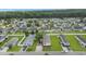 Birds-eye view of a neighborhood with well-kept homes, green lawns, and parked cars at 259 Iroquis Trail, Longs, SC 29568