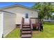 Back entrance deck with stairs, grill, and plenty of space; great for grilling and outdoor enjoyment at 259 Iroquis Trail, Longs, SC 29568
