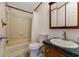 Full bathroom features a tub and shower combination, toilet, and vanity with a mirror at 259 Iroquis Trail, Longs, SC 29568