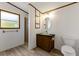 Cozy bathroom featuring an updated vanity, shower, and modern fixtures at 259 Iroquis Trail, Longs, SC 29568