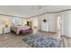 Bright bedroom featuring wood-look floors, ceiling fan and a decorative rug at 259 Iroquis Trail, Longs, SC 29568