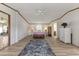 Bright bedroom featuring wood-look floors, ceiling fan and a decorative rug at 259 Iroquis Trail, Longs, SC 29568