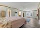 Spacious bedroom featuring lots of natural light, wood-look floors, and walk-in closet at 259 Iroquis Trail, Longs, SC 29568