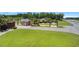 Gated community entrance with brick features, lush landscaping, and a clear view of the welcoming sign at 259 Iroquis Trail, Longs, SC 29568