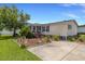 Well-maintained home features a beautiful landscaped yard and a welcoming front entrance, perfect for curb appeal at 259 Iroquis Trail, Longs, SC 29568