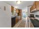 Galley style kitchen with wood cabinets, stainless steel appliances and durable countertops at 259 Iroquis Trail, Longs, SC 29568