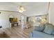 Spacious living room with wood-look floors, comfortable seating and plenty of natural light at 259 Iroquis Trail, Longs, SC 29568