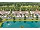 A picturesque aerial view of townhomes with a tranquil pond and manicured landscaping, near lush green golf course at 265 Connemara Dr. # D, Myrtle Beach, SC 29579
