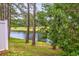 Scenic backyard with views of a serene lake and a lush golf course at 265 Connemara Dr. # D, Myrtle Beach, SC 29579