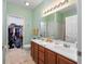 Bathroom featuring a double vanity, walk-in closet and a separate shower area at 265 Connemara Dr. # D, Myrtle Beach, SC 29579