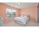 Bright bedroom with a large window and view of the outdoors at 265 Connemara Dr. # D, Myrtle Beach, SC 29579