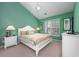 Inviting bedroom with high ceilings, a ceiling fan and a comfortable bed at 265 Connemara Dr. # D, Myrtle Beach, SC 29579