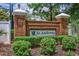 A brick community entrance sign with lush green landscaping welcomes you to St. Andrews at 265 Connemara Dr. # D, Myrtle Beach, SC 29579