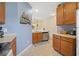 Bright kitchen featuring wooden cabinets, stainless appliances, and neutral tile flooring at 265 Connemara Dr. # D, Myrtle Beach, SC 29579