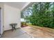 Covered patio with peaceful views of a lake and lush greenery, perfect for outdoor relaxation at 265 Connemara Dr. # D, Myrtle Beach, SC 29579