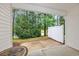 Covered patio offers a peaceful outdoor retreat with views of the surrounding greenery and lake at 265 Connemara Dr. # D, Myrtle Beach, SC 29579
