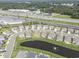 An aerial view highlights the community, landscaping, pond, and proximity to shopping, restaurants and highway at 2989 Skylar Dr., Myrtle Beach, SC 29577