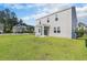 Home's backyard features a covered patio and a dark metal fence surrounding the yard at 2989 Skylar Dr., Myrtle Beach, SC 29577