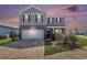 A two-story home exterior with a two car garage and low maintenance landscaping at 2989 Skylar Dr., Myrtle Beach, SC 29577