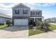 Charming two-story home with gray siding, a well-maintained front yard, and a two-car garage at 2989 Skylar Dr., Myrtle Beach, SC 29577