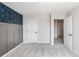 Hallway with carpet, white doors, and stylish blue wallpaper in adjacent bedroom at 2989 Skylar Dr., Myrtle Beach, SC 29577