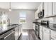 Well-lit kitchen featuring stainless steel appliances, granite countertops, and white cabinets at 2989 Skylar Dr., Myrtle Beach, SC 29577