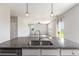 Spacious kitchen with granite countertops and stainless steel appliances, overlooking the living area at 2989 Skylar Dr., Myrtle Beach, SC 29577