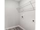 Laundry area with vinyl flooring, wire shelving, utility connections and electrical outlets at 2989 Skylar Dr., Myrtle Beach, SC 29577